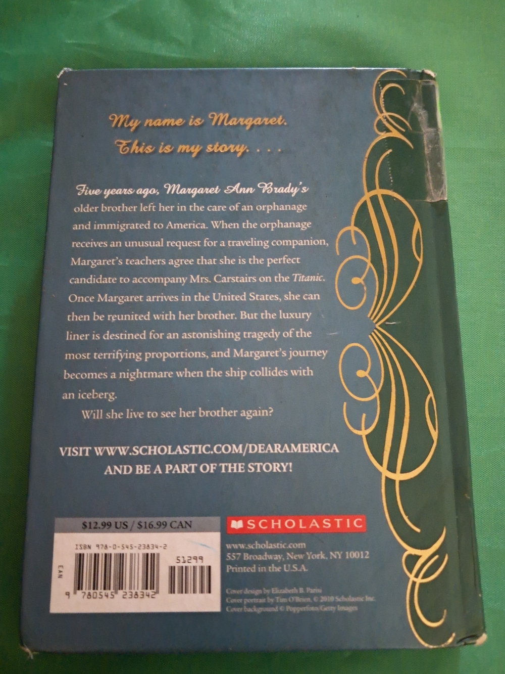 Scholastic Hardcover with Blue Cover and Gold Decorative Accents - Picture 2 of 4